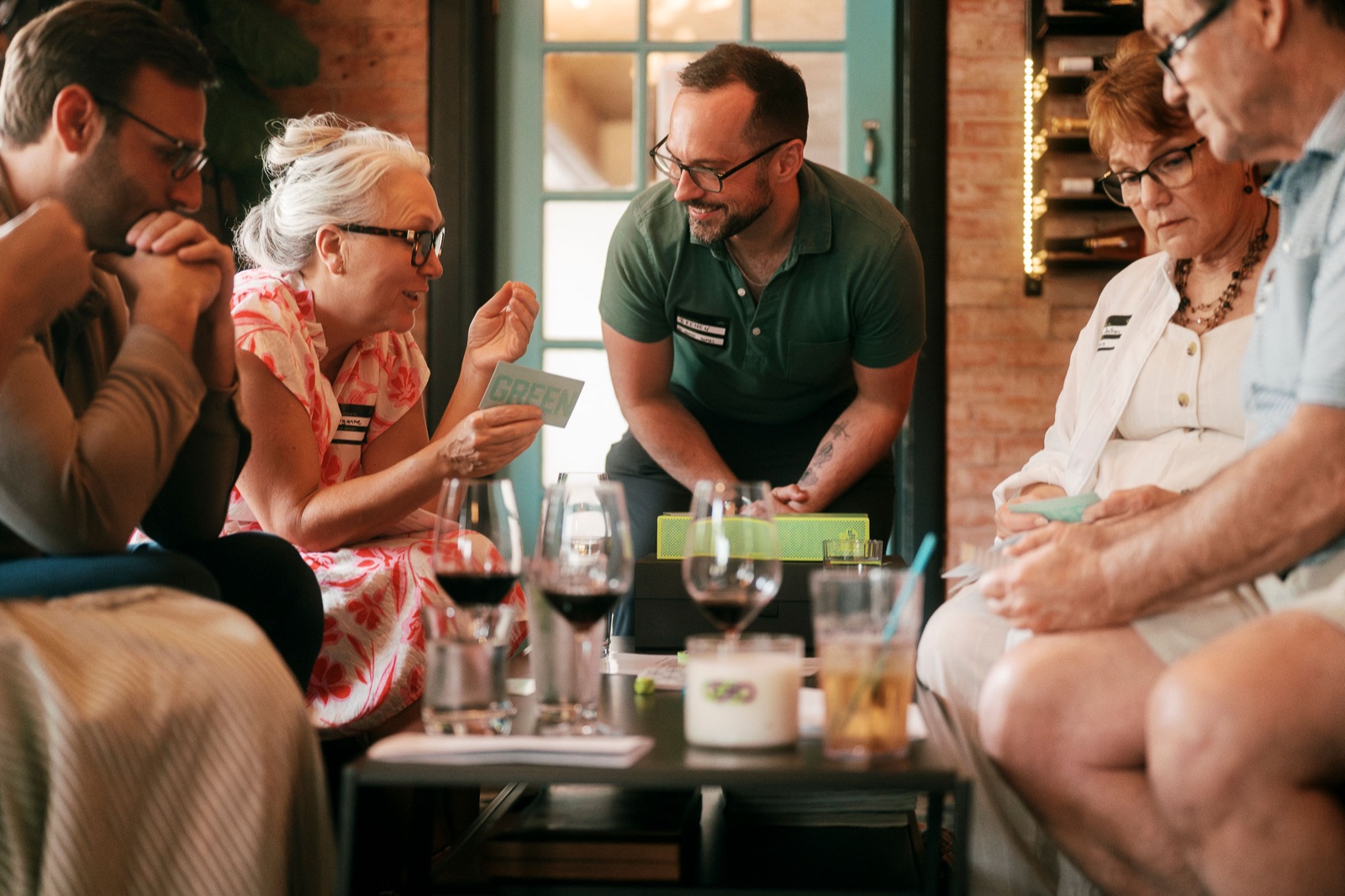 brenen hosting a sunlit table of guests