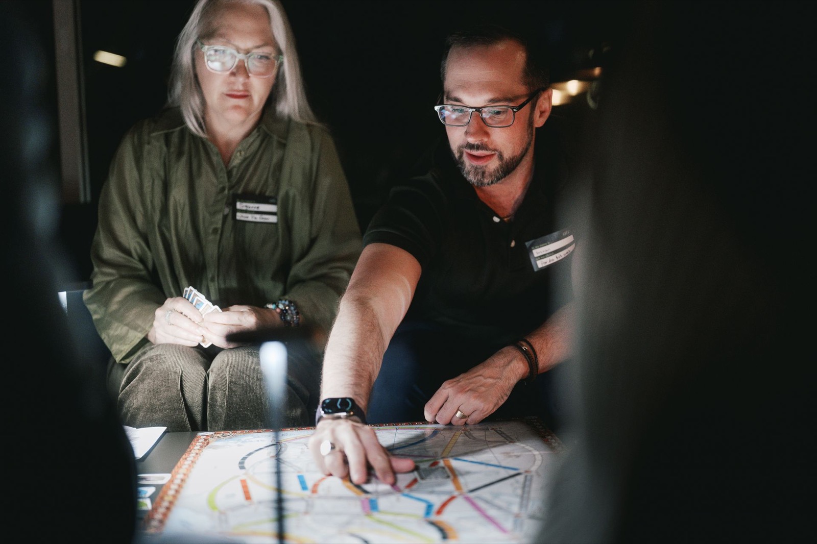 brenen teaching a game across the table